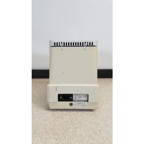 Cream-colored plastic eppendorf 5415c micro centrifuge back with vented top and power port visible