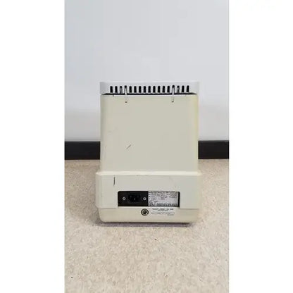 Cream-colored plastic eppendorf 5415c micro centrifuge back with vented top and power port visible
