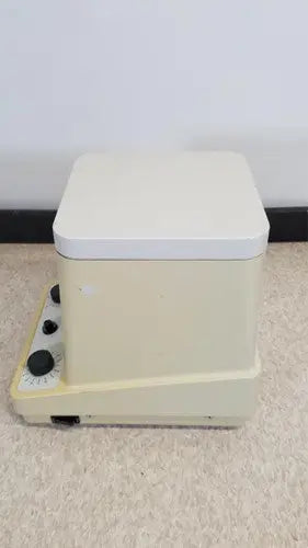 Cream-colored eppendorf 5415c micro centrifuge with rectangular design white lid and black control knobs