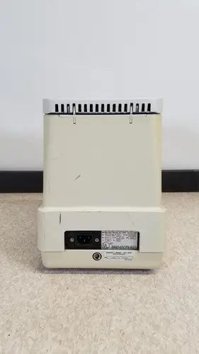 Cream-colored plastic eppendorf 5415c micro centrifuge back with vented top and power port visible