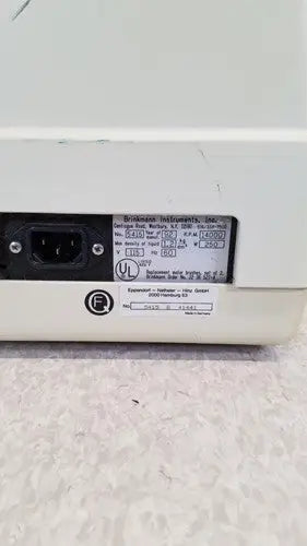 Back of white eppendorf 5415c micro centrifuge plastic device with black power input port and technical label