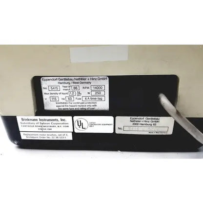 Black rectangular label on the back of eppendorf refrigerated unit centrifuge 5415 with voltage rpm specs and ul certification