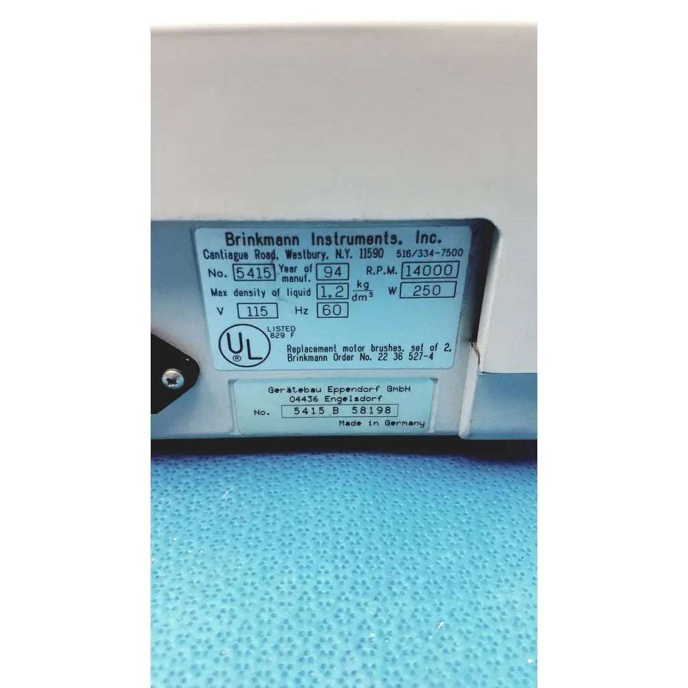 White plastic label with black text and ul mark showing technical specs for eppendorf centrifuge laboratory model w250
