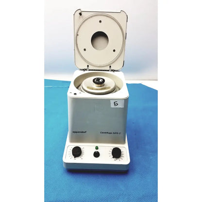White Eppendorf centrifuge laboratory model W250 with circular rotor chamber and two black control knobs on front panel