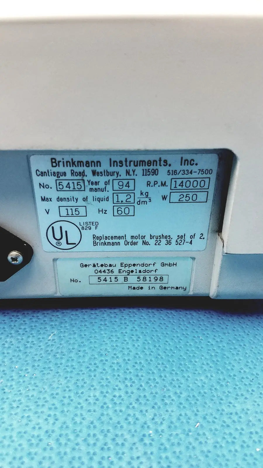 White plastic label with black text and ul mark showing technical specs for eppendorf centrifuge laboratory model w250