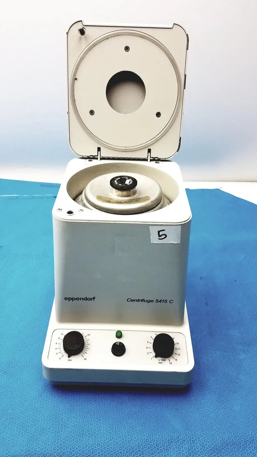 White Eppendorf centrifuge laboratory model W250 with circular rotor chamber and two black control knobs on front panel