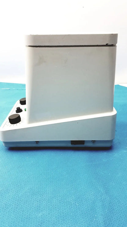 Eppendorf centrifuge laboratory model W250 with white body, black control knobs, and gray base for precise sample separation
