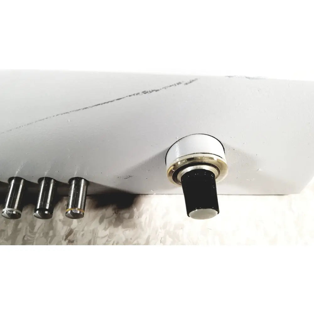 White plastic knob with metallic ring and black center on eppendorf centrifuge 5415 r for reuse medical applications