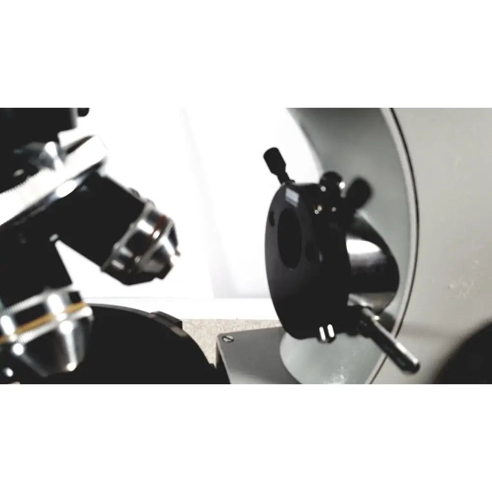 Black and silver microscope stage with adjustable knobs on eppendorf centrifuge 5415 r for reuse medical applications