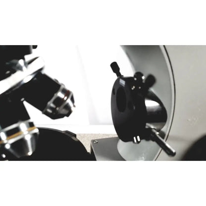 Black and silver microscope stage with adjustable knobs on eppendorf centrifuge 5415 r for reuse medical applications