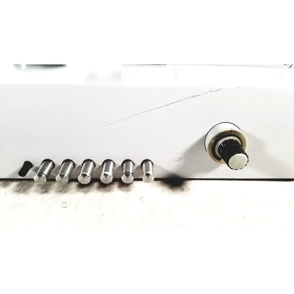 White eppendorf centrifuge 5415 r with six silver metal pins and black-and-white rotary knob for reuse medical applications