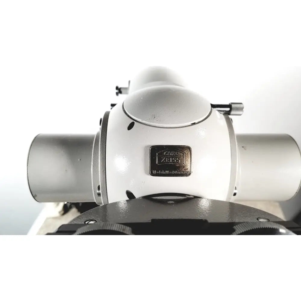 White and silver carl zeiss microscope with metallic brand plate featured in eppendorf centrifuge 5415 r for reuse medical applications