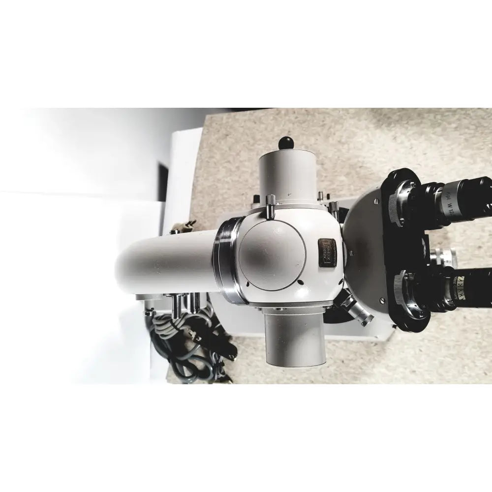 A sleek silver and black eppendorf centriifuge 5415 r with dual eyepieces and sturdy metallic body for reuse medical use