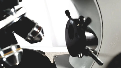 Black and silver microscope stage with adjustable knobs on eppendorf centrifuge 5415 r for reuse medical applications