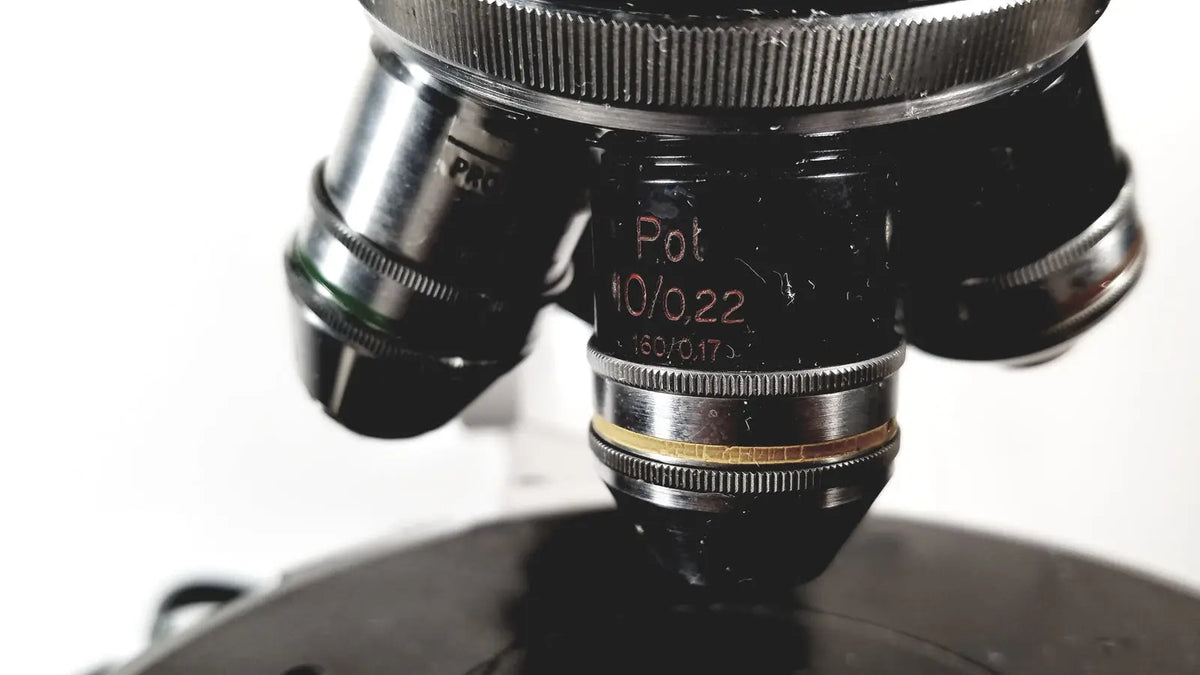 Black microscope objective lens with silver metallic rings and engraved markings for eppendorf centrifuge reuse medical use