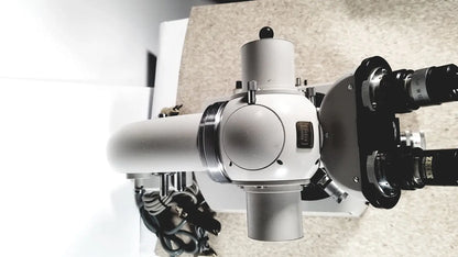 A sleek silver and black eppendorf centriifuge 5415 r with dual eyepieces and sturdy metallic body for reuse medical use