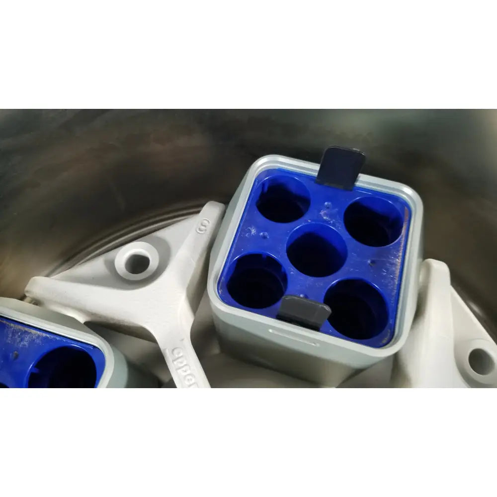 Blue and gray plastic ice cube tray with six circular compartments for reuse medical applications in eppendorf centriifuge model 5810
