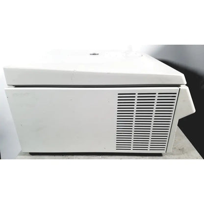 White laboratory eppendorf centriifuge model 5810 with hinged lid and vertical ventilation slats for reuse medical applications