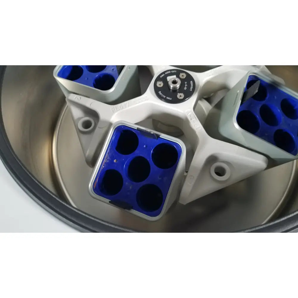 White and blue laboratory centrifuge rotor with six circular wells for reuse medical applications in eppendorf centriifuge model 5810