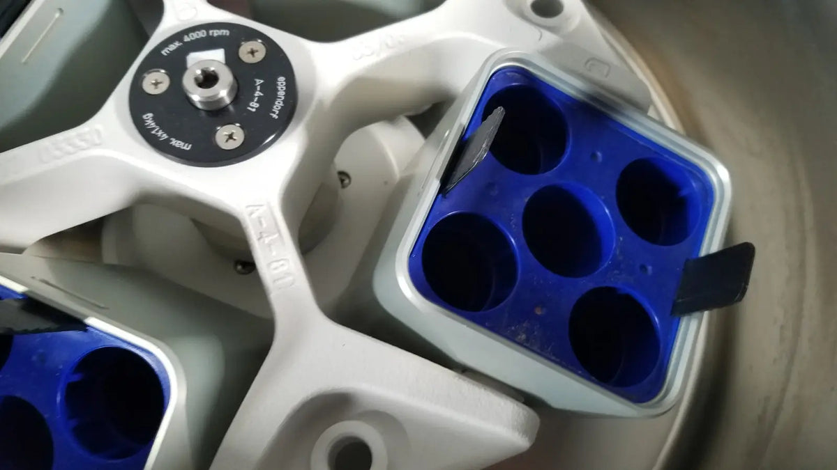 Blue plastic centrifuge tube holder with white frame for eppendorf centriifuge model 5810 laboratory use