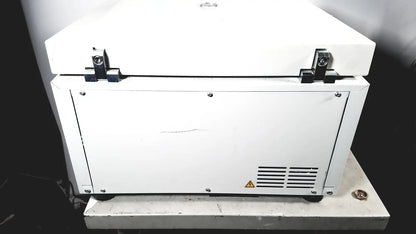 White rectangular laboratory eppendorf centriifuge model 5810 with black latches and vented side panel