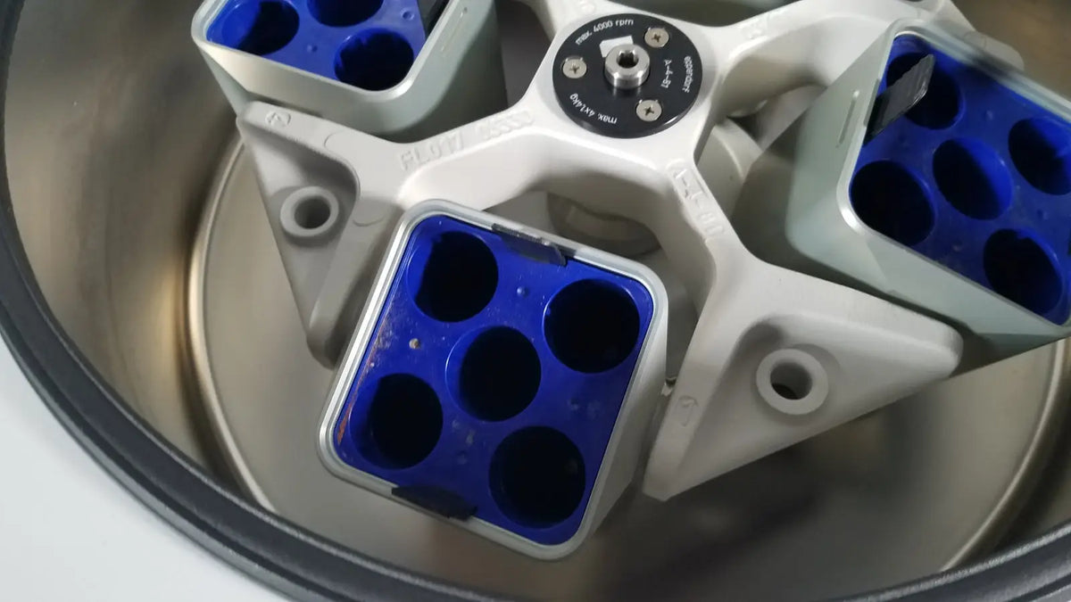 White and blue laboratory centrifuge rotor with six circular wells for reuse medical applications in eppendorf centriifuge model 5810
