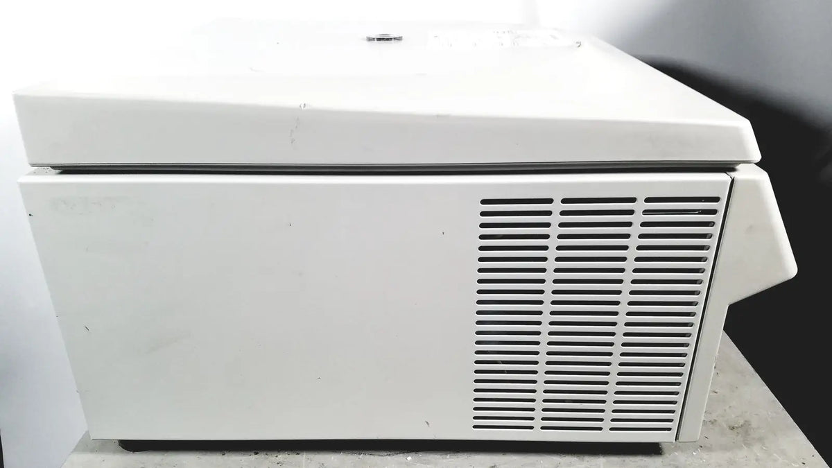 White laboratory eppendorf centriifuge model 5810 with hinged lid and vertical ventilation slats for reuse medical applications