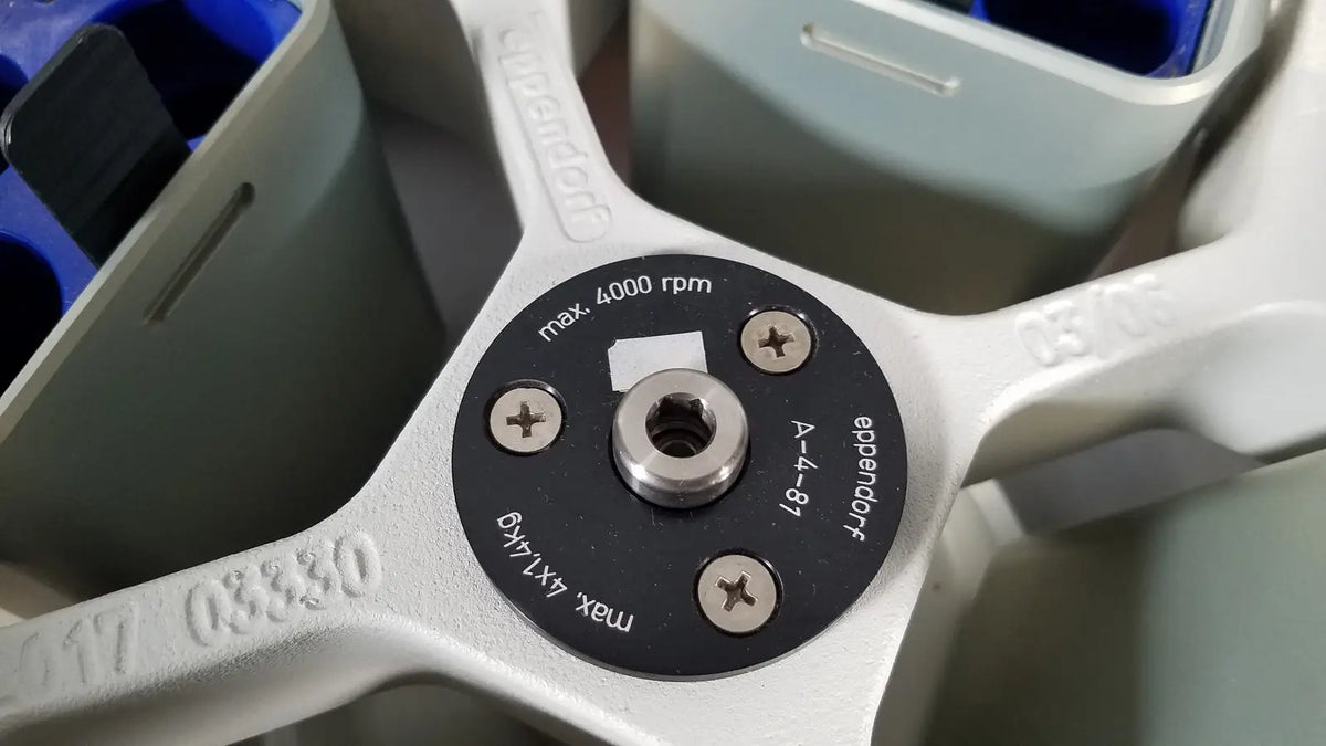 White plastic rotor with black central hub and engraved specifications for eppendorf centriifuge model 5810