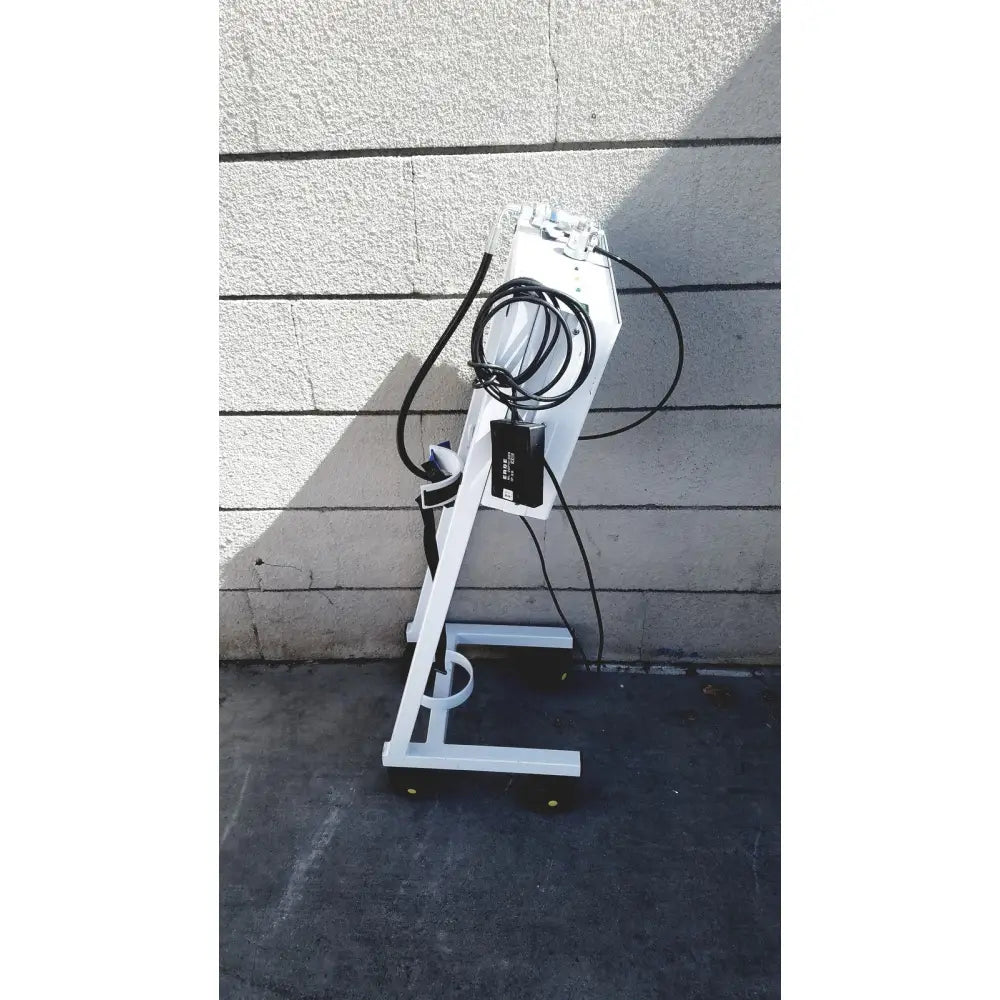 White metal erbe erbokryo cryosurgical unit 30448-014 with black cables power adapter and yellow caster wheels