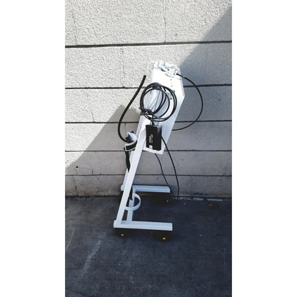 White metal erbe erbokryo cryosurgical unit 30448-014 with black cables power adapter and yellow caster wheels