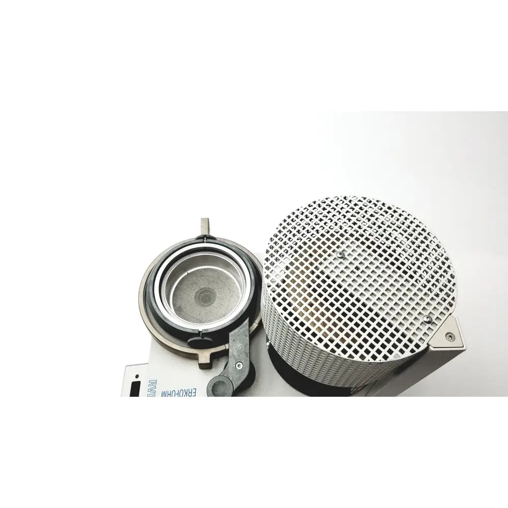 Silver mesh cylindrical filter with black rubber gasket mounted on metallic base for erkodent erkoform-rve dental lab thermoforming