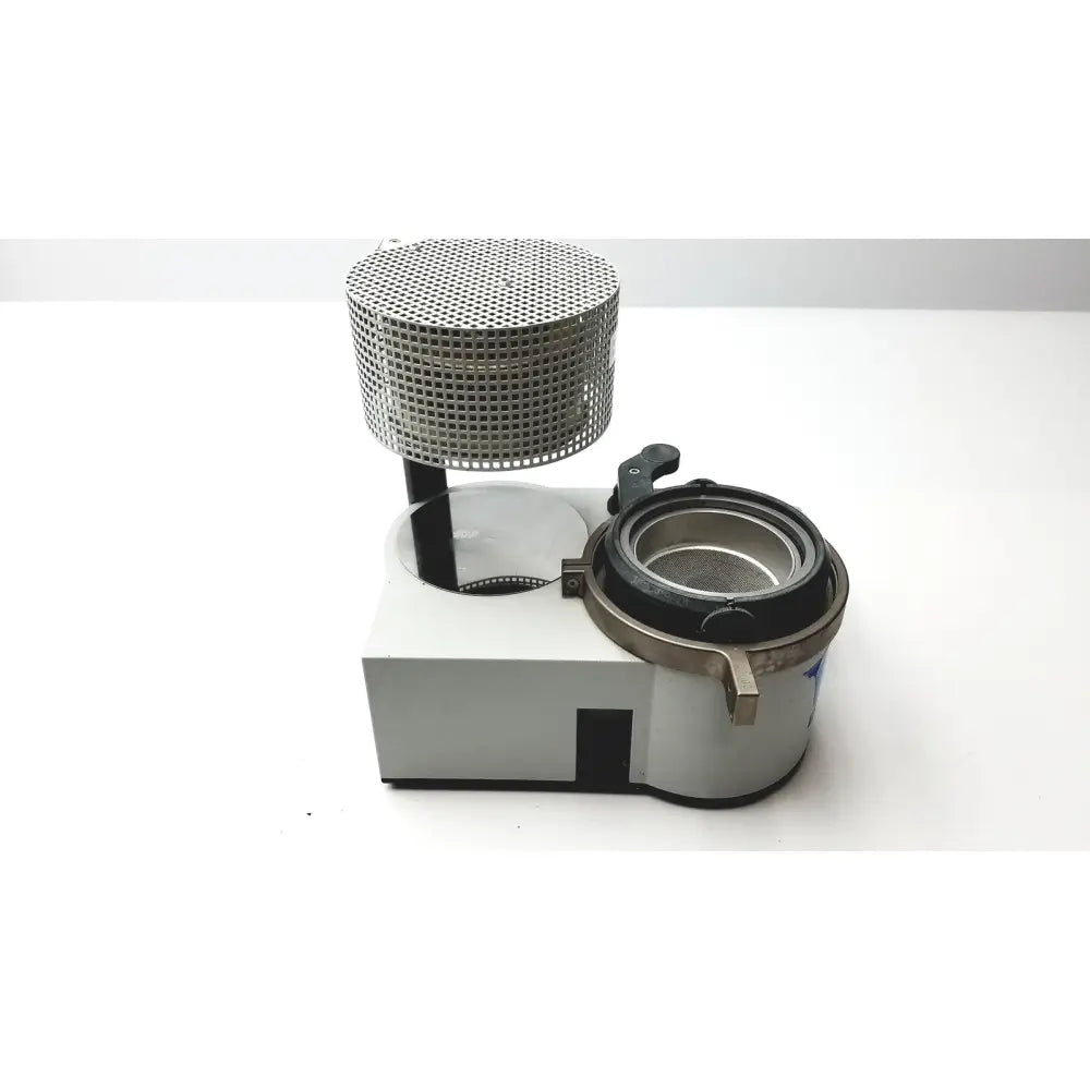 Silver perforated cylindrical mesh top with black base and metallic parts of Erkodent Erkoform-RVE dental lab thermoforming system