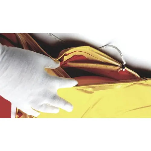 Evacusled emergency patient evacuation sled mobility device with yellow and red inflatable life jacket and white zipper pull
