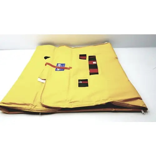 Yellow fabric evacuation sled mobility device with red and black rectangular patches for emergency patient evacuation
