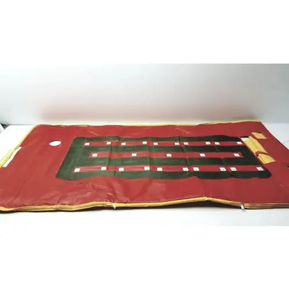 Red fabric casino table mat with green and black betting layout and gold trim edges featured with evacuation sled mobility device