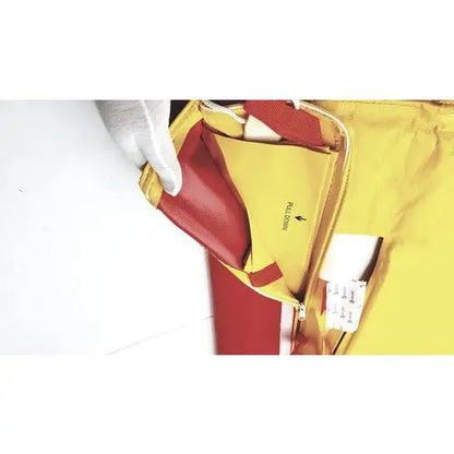 A vibrant yellow and red leather travel pouch with zipper and interior pull down pocket for evacuation sled mobility