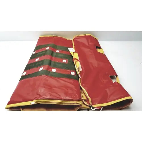 Evacusled emergency patient evacuation sled featuring a red and green striped inflatable mattress with yellow trim
