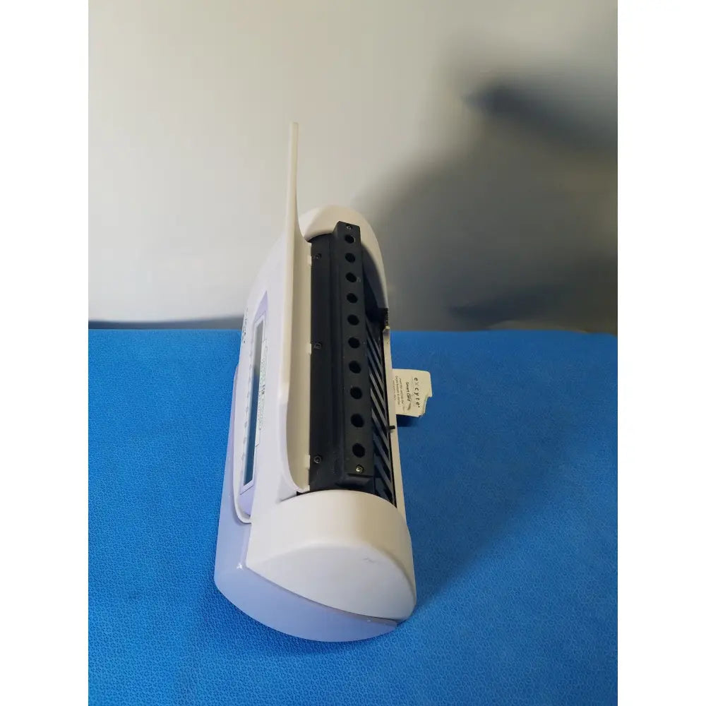 Excyte m automated esr analyzer featuring a white plastic wireless router with black ventilation slats and small antenna