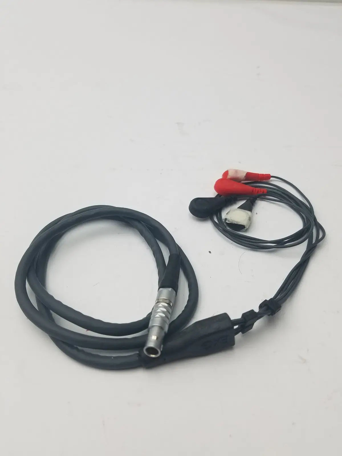 Black coiled lead set cable with metallic connector and red and white alligator clips for ekg ecg use