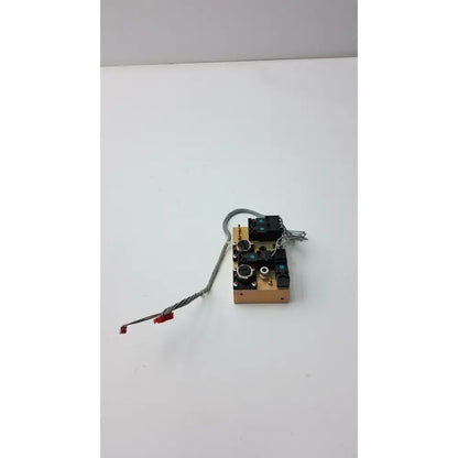 A compact evita xl mechanical ventilator module with a light brown wooden base and black plastic components by fasmedic dräger