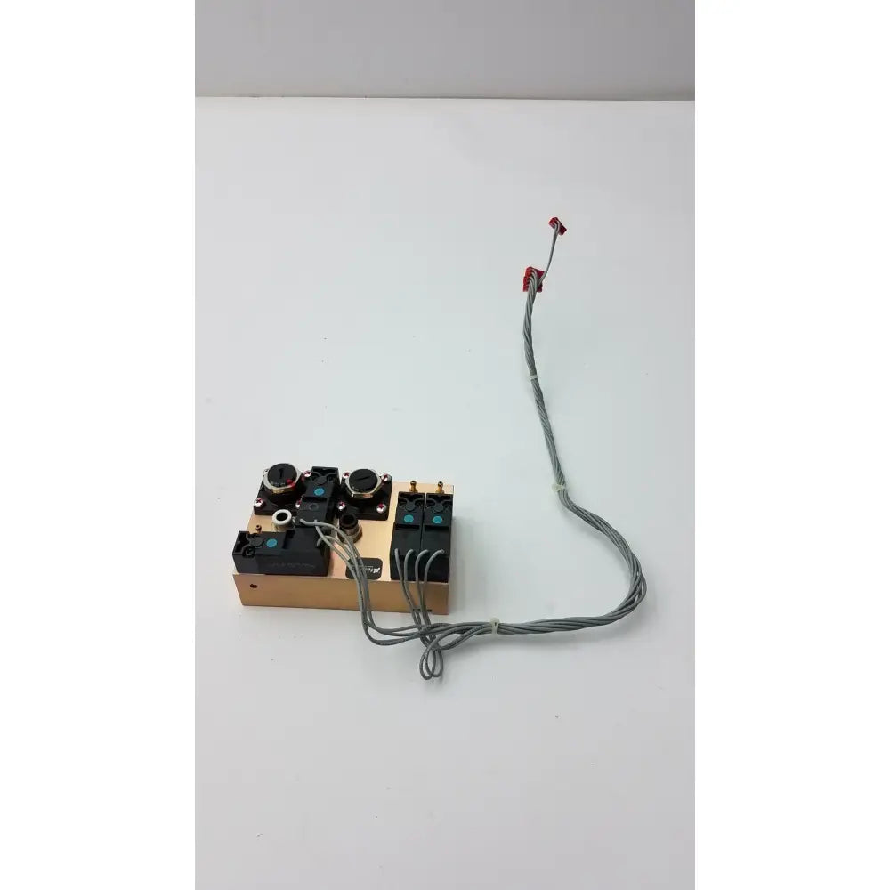 Beige rectangular electronic control panel with black knobs and switches connected by gray wires on fasmedic dräger evita xl mechanical ventilator
