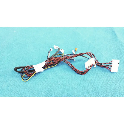 A tangle of red, black, and yellow female multi-pin connectors wire harness cables with white plastic connectors