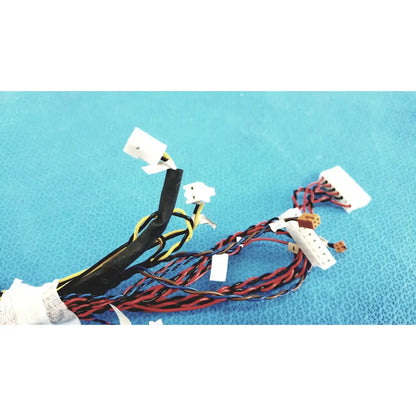 A bundle of female multi-pin connectors wire harness cables with black red and yellow wires ending in white plastic connectors