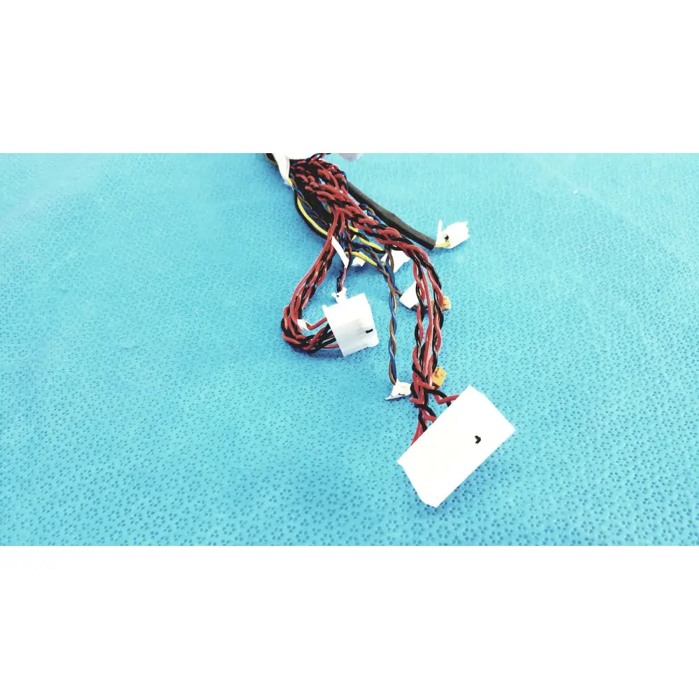 A bundle of red and black female multi-pin connectors wire harness cables with white plastic connectors for electrical use