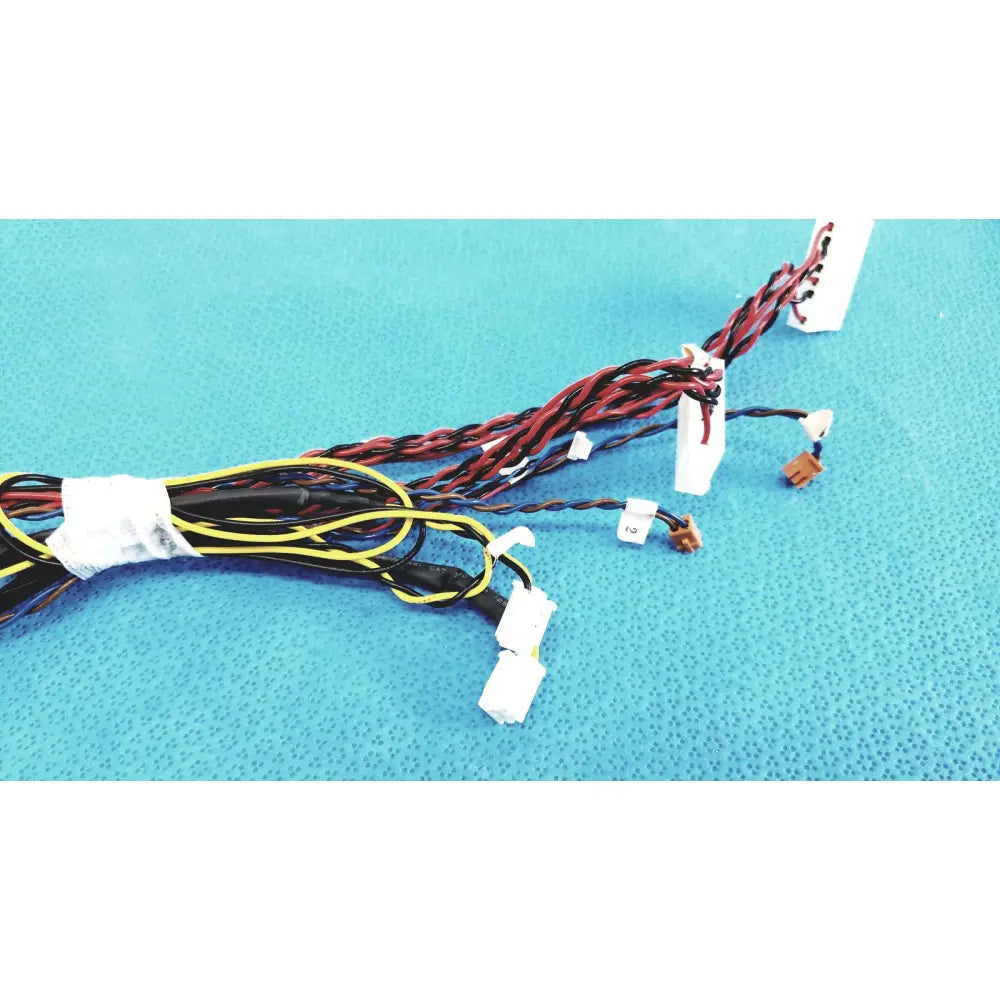 A bundle of multicolored female multi-pin connectors wire harness cables with white and brown connectors