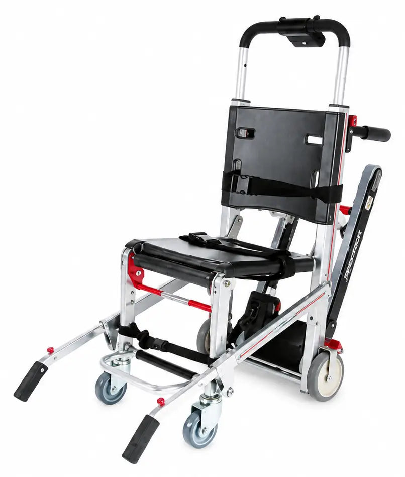 Silver and black aluminum-framed ferno model 59-T ez-glide evacuation stair chair with red accents and caster wheels