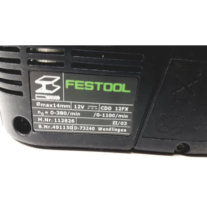 Image of the back side of a black festool dd-es cdd12fx circular saw with green logo and technical specifications label