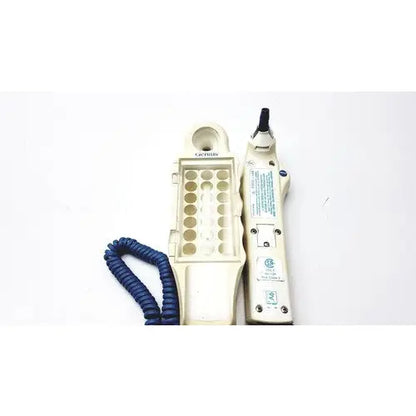 Cream-colored lexicon telephone handset with coiled blue cord and modular jack tool for firsttemp genius calibrator reuse medical use