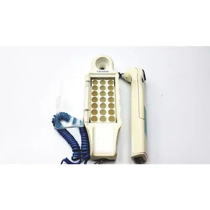Cream-colored cactus brand hair straightener and handheld device with blue coiled cord for firsttemp genius calibrator use