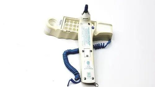 Beige medical device with blue coiled cord and matching tray with circular wells for firsttemp genius calibrator